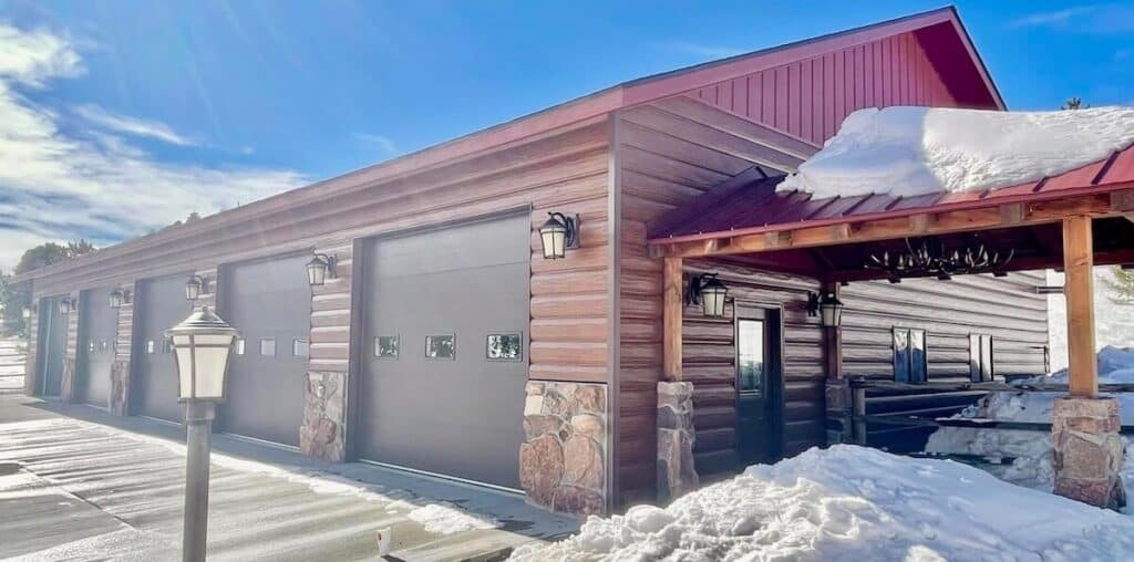 Barndominium vs. house: A barndo featuring a combo of TruLog steel board and batten siding and steel log siding, both in western cedar