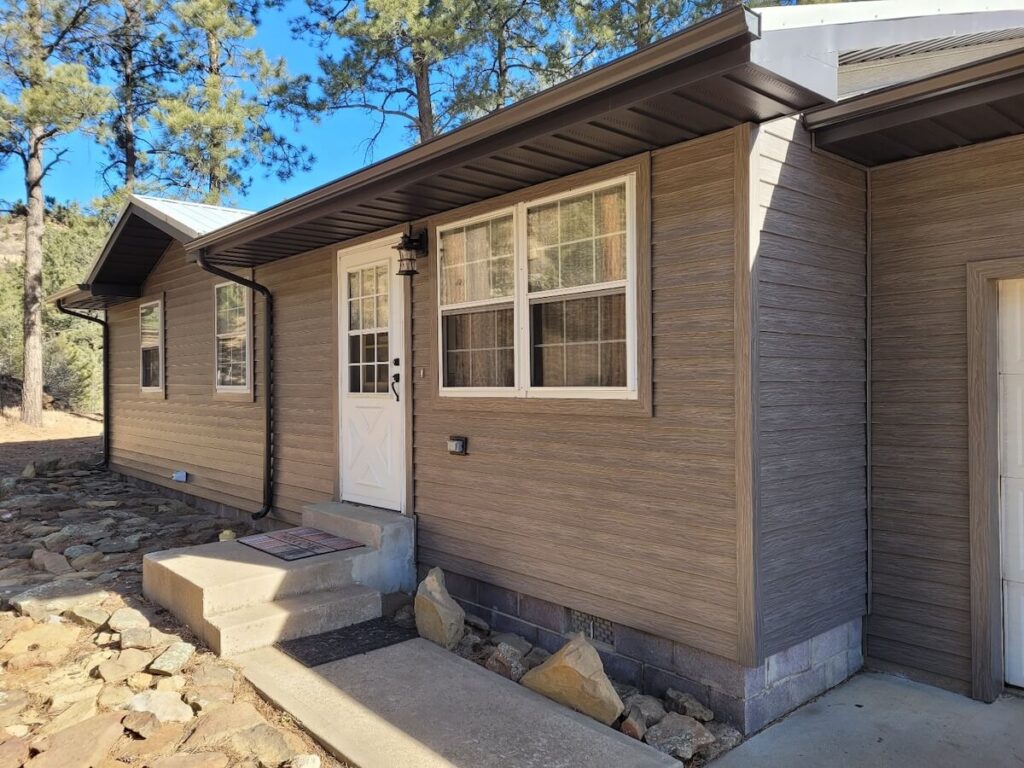 Dutch lap vs. clapboard: The front of a home with TruLog steel lap siding