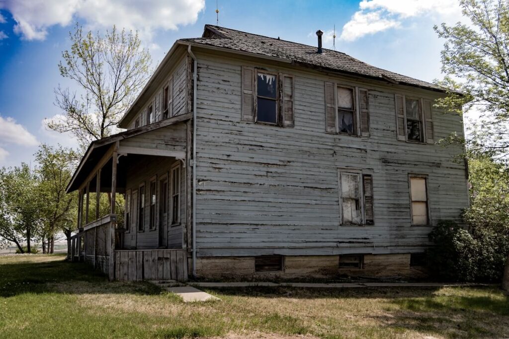 A home with damaged wood siding