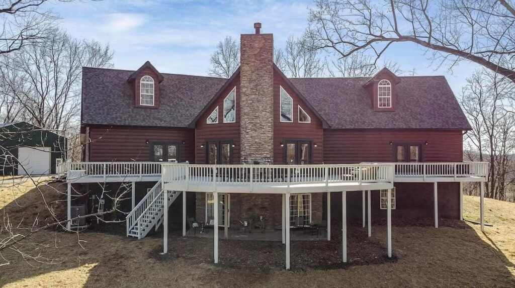 A home with a large deck and TruLog steel log siding in Western Cedar