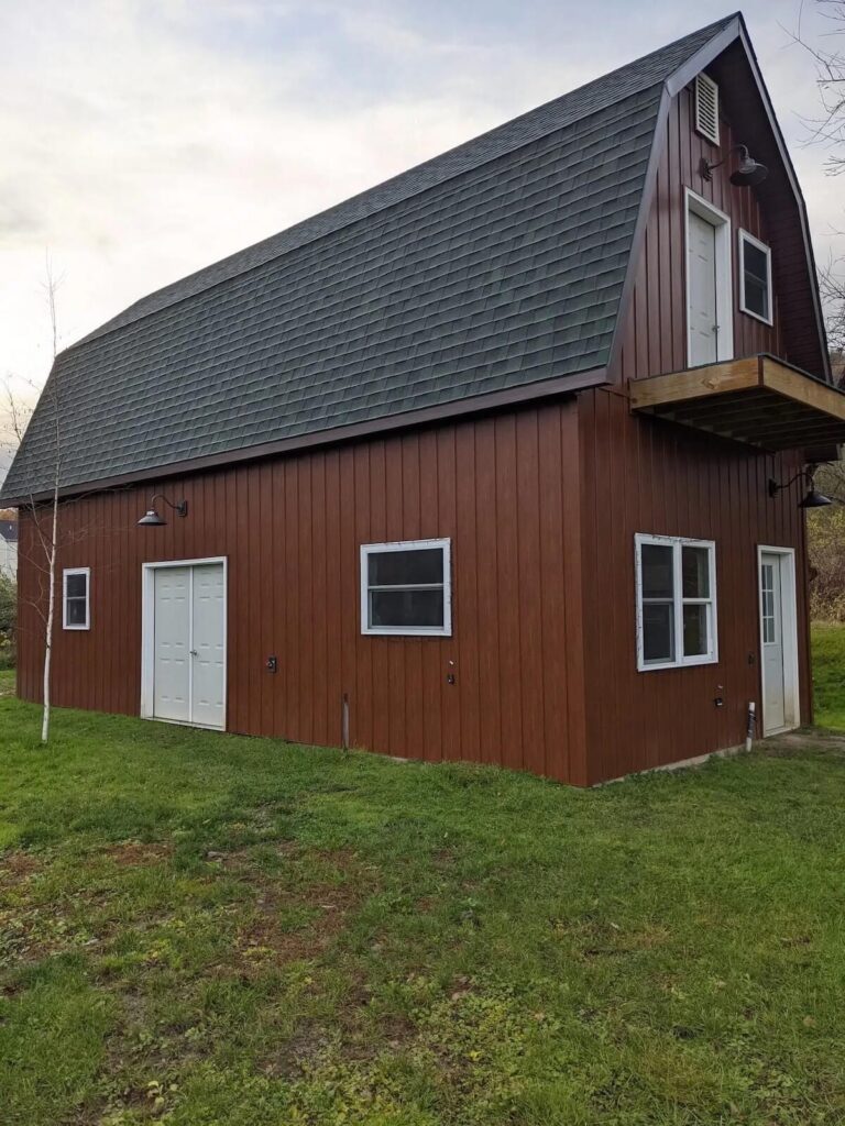 A barndominium with TruLog steel board and batten siding in western cedar