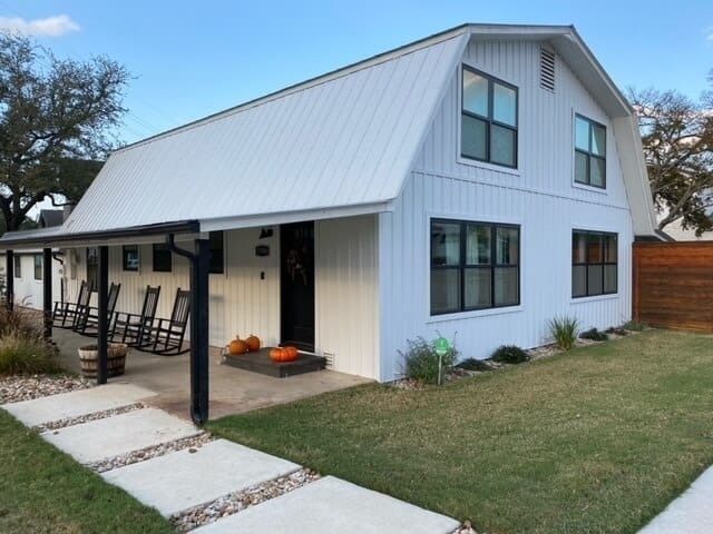 A barndominium with TruLog's white matte board and batten siding
