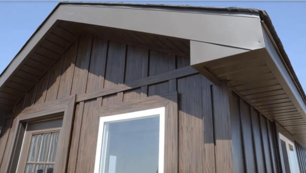 A closeup of TruLog steel board and batten siding