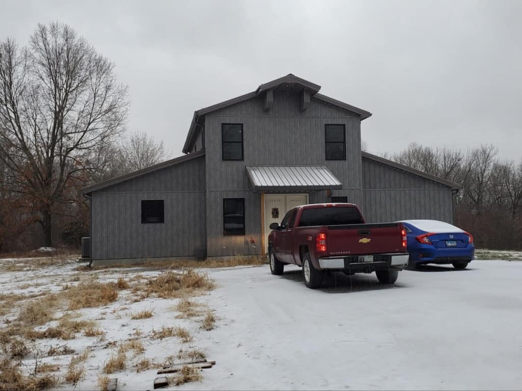 A house with TruLog steel board and batten siding in Weathered Gray
