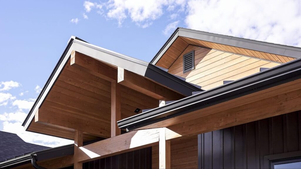 A home's roof gables TruLog steel soffit and fascia in Dark Charcoal