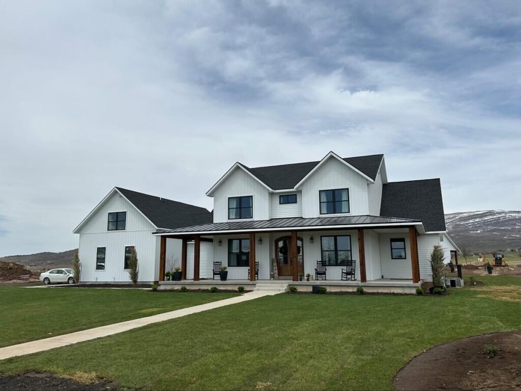 A home with TruLog steel board and batten in white matte, a high-quality choice for a siding replacement