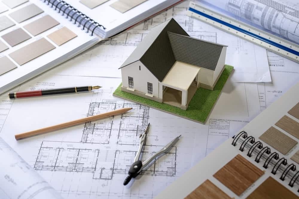 House model on Buleprint construction drawing and drawing equipment stationary