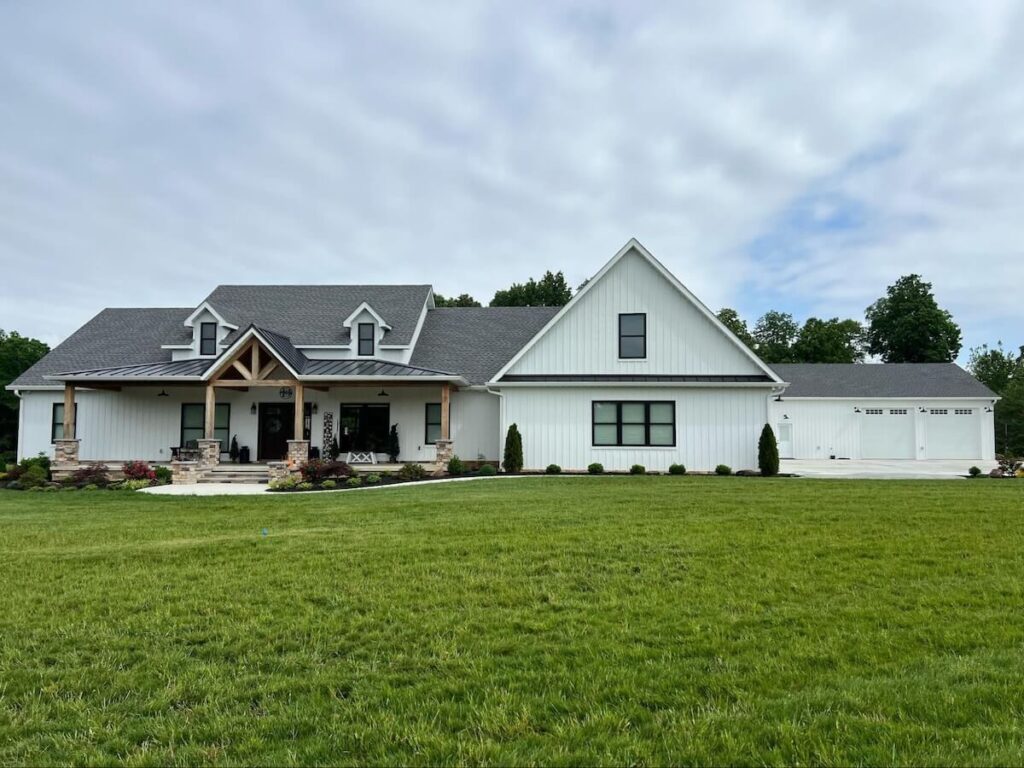 A modern farmhouse with TruLog steel board and batten siding in Matte White