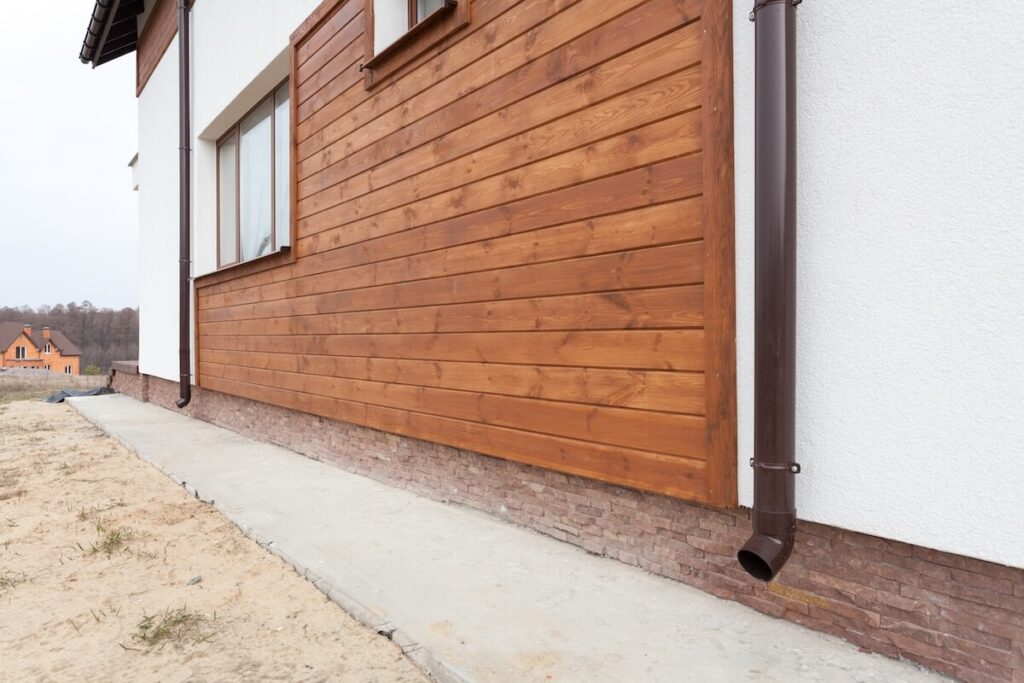 A home with a wood siding feature wall on its exterior