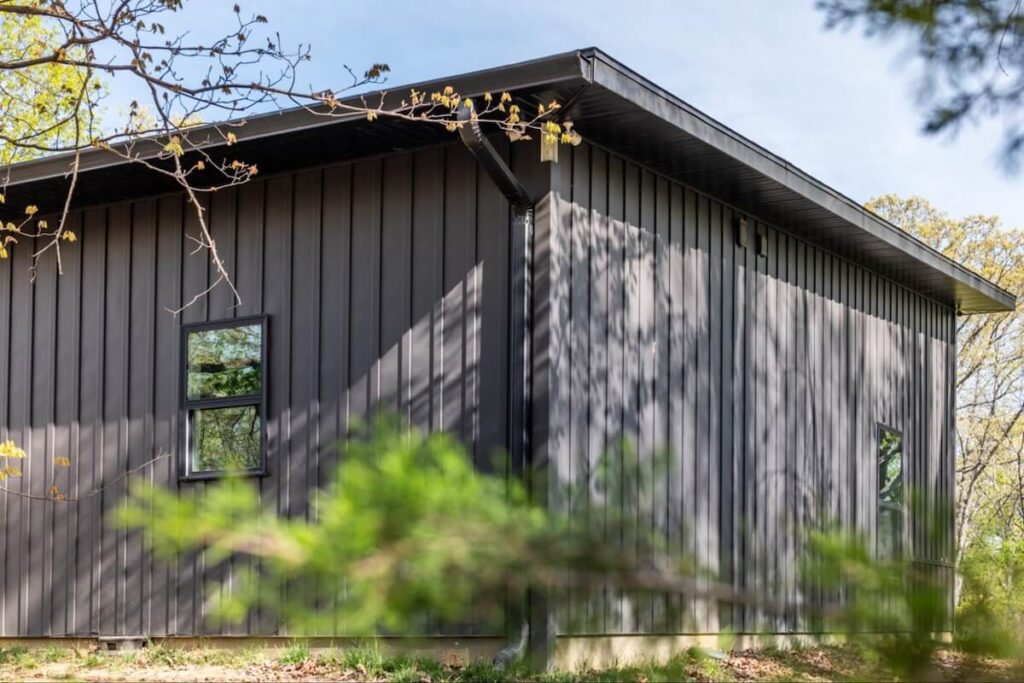 A home with TruLog steel board and batten siding that has a 30-year paint coat warranty