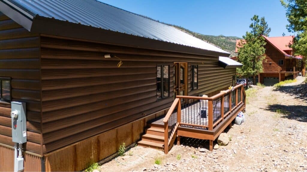 A home featuring TruLog steel fascia and log siding