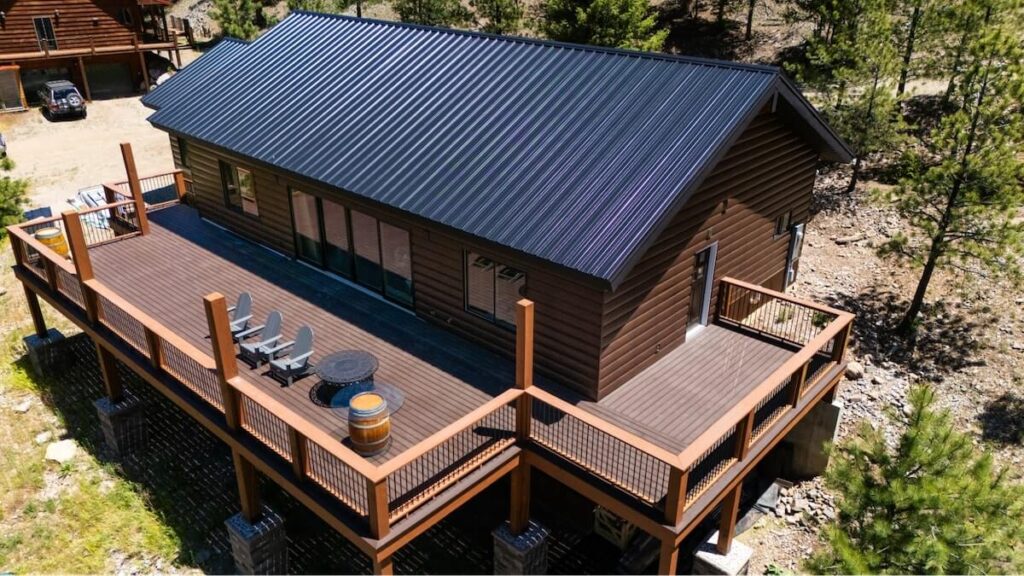 A home amongst the pines with TruLog steel log siding, one of the most durable siding options