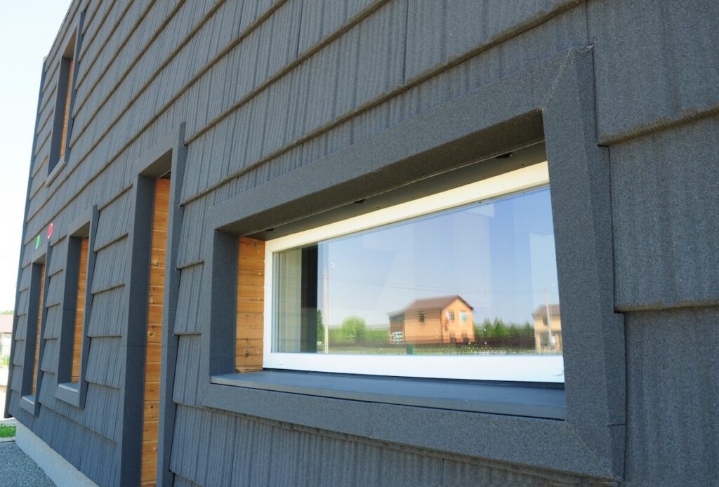 A closeup of a home's fiber cement siding with a pronounced vertical grain