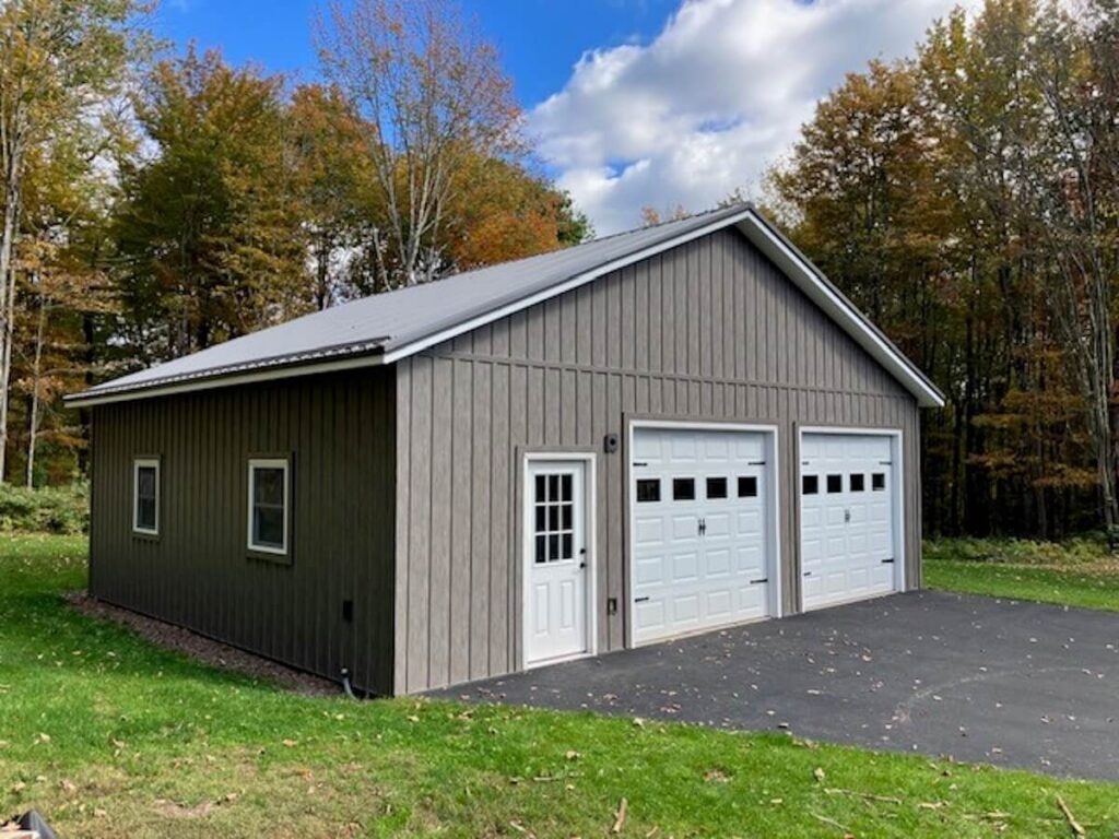 A garage and workshop with TruLog steel board and batten siding in Weathered Gray