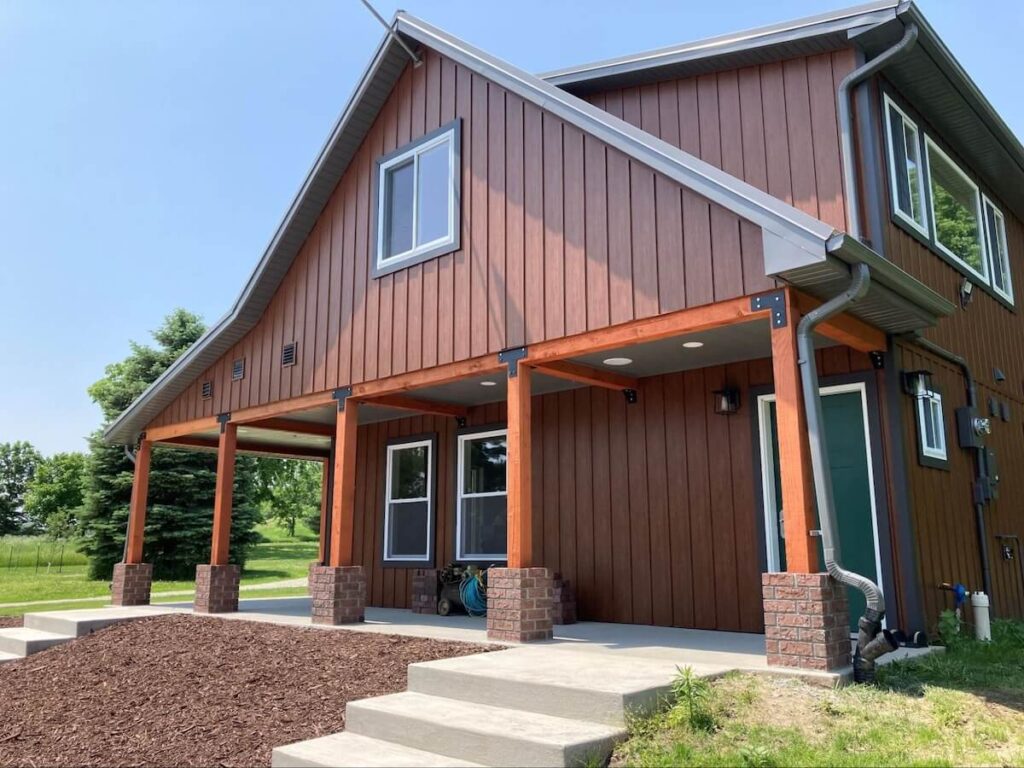 A home with new TruLog steel board and batten siding