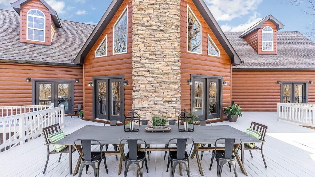 A beautiful back deck on a home with TruLog steel log siding