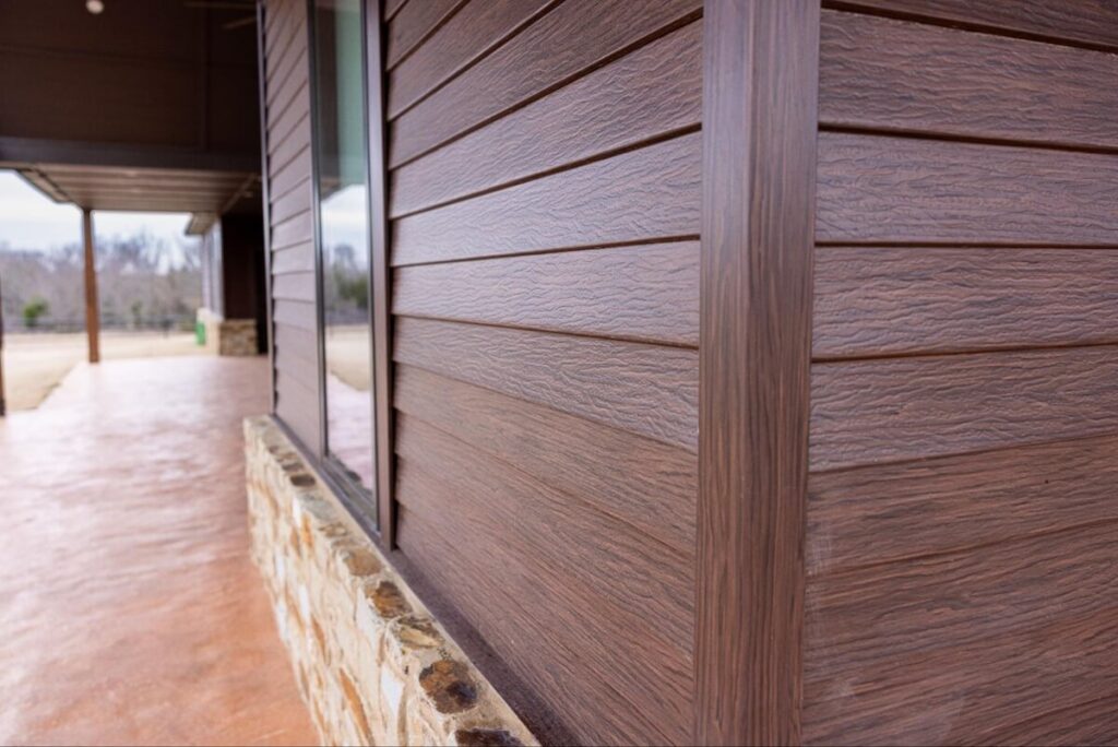 A closeup of TruLog's steel lap siding with a wood-like finish