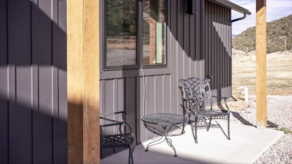 A closeup of a home with TruLog steel board and batten siding