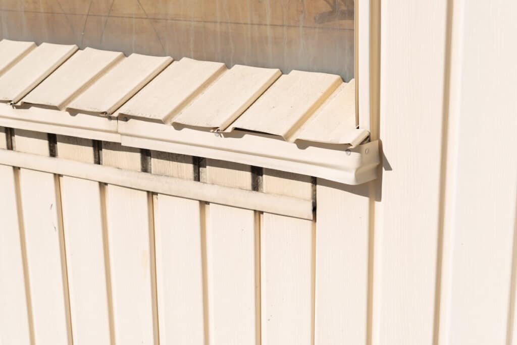 A closeup of painted aluminum siding, which has both pros and cons