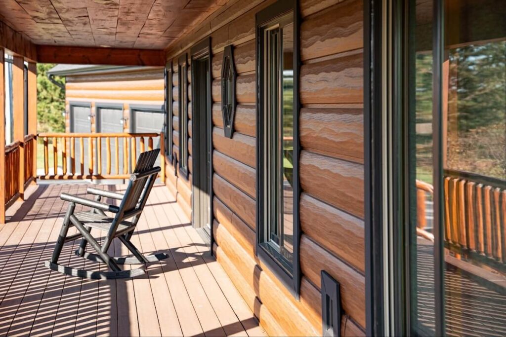 The front porch of a cabin with TruLog steel log siding