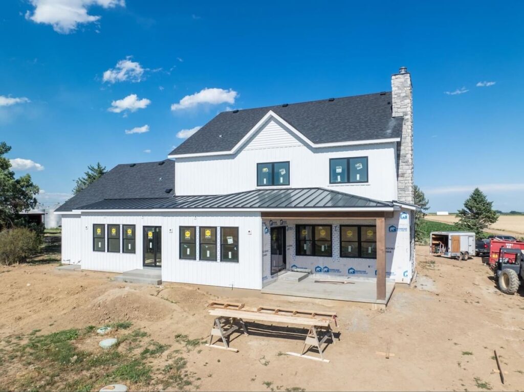 A new home having TruLog steel board and batten siding installed