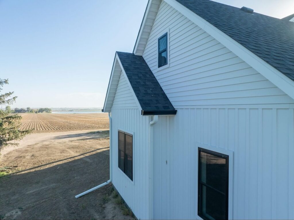 The side of a home with a mix of TruLog steel lap and board and batten siding