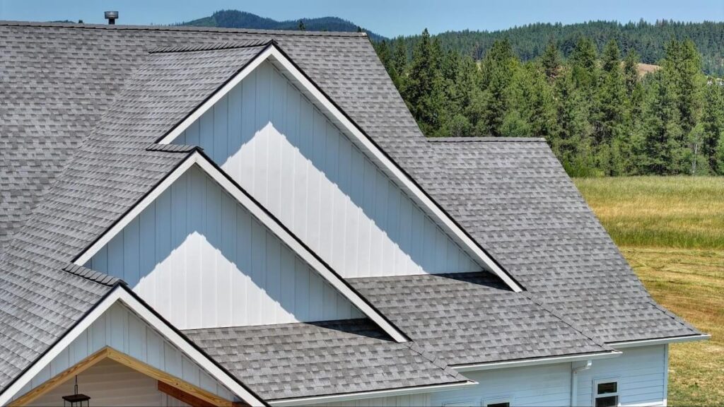 Three overlapping roof gables with TruLog steel board and batten siding in Matte White