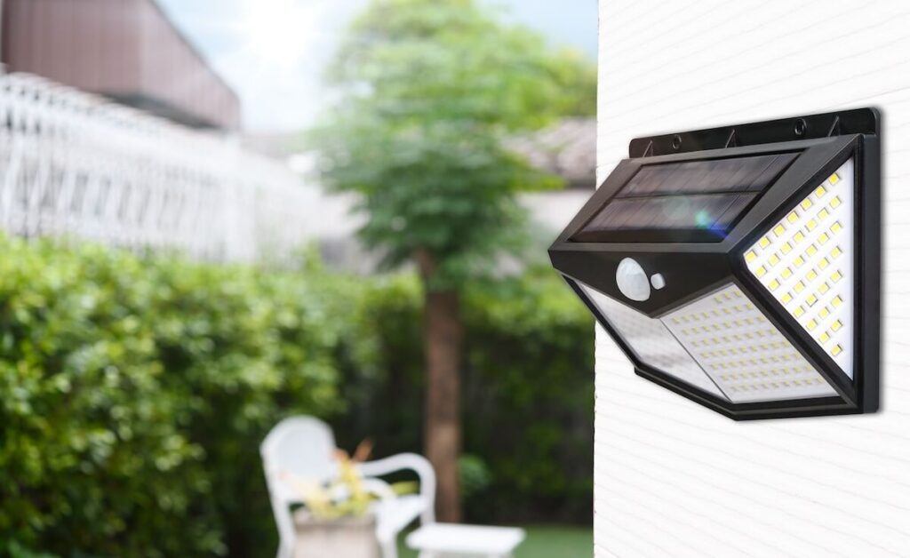 A closeup of a solar-powered exterior light on a home