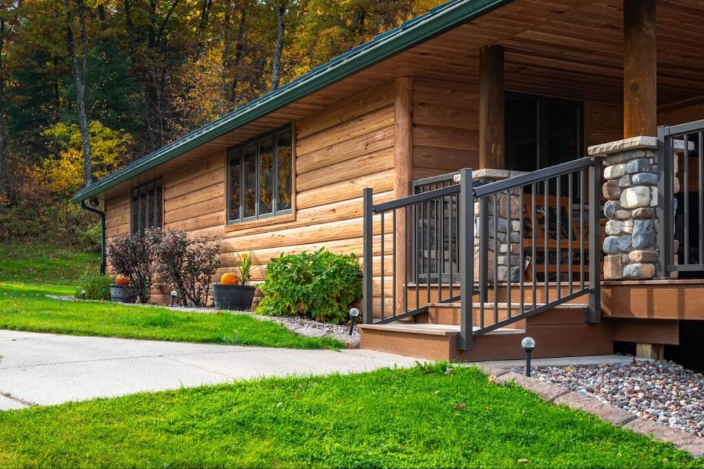 A closeup of a cabin with TruLog steel log siding in Hickory
