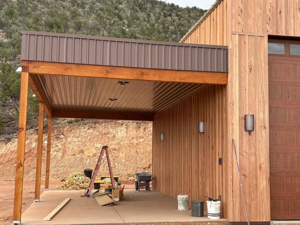 A home having new TruLog steel board and batten siding installed