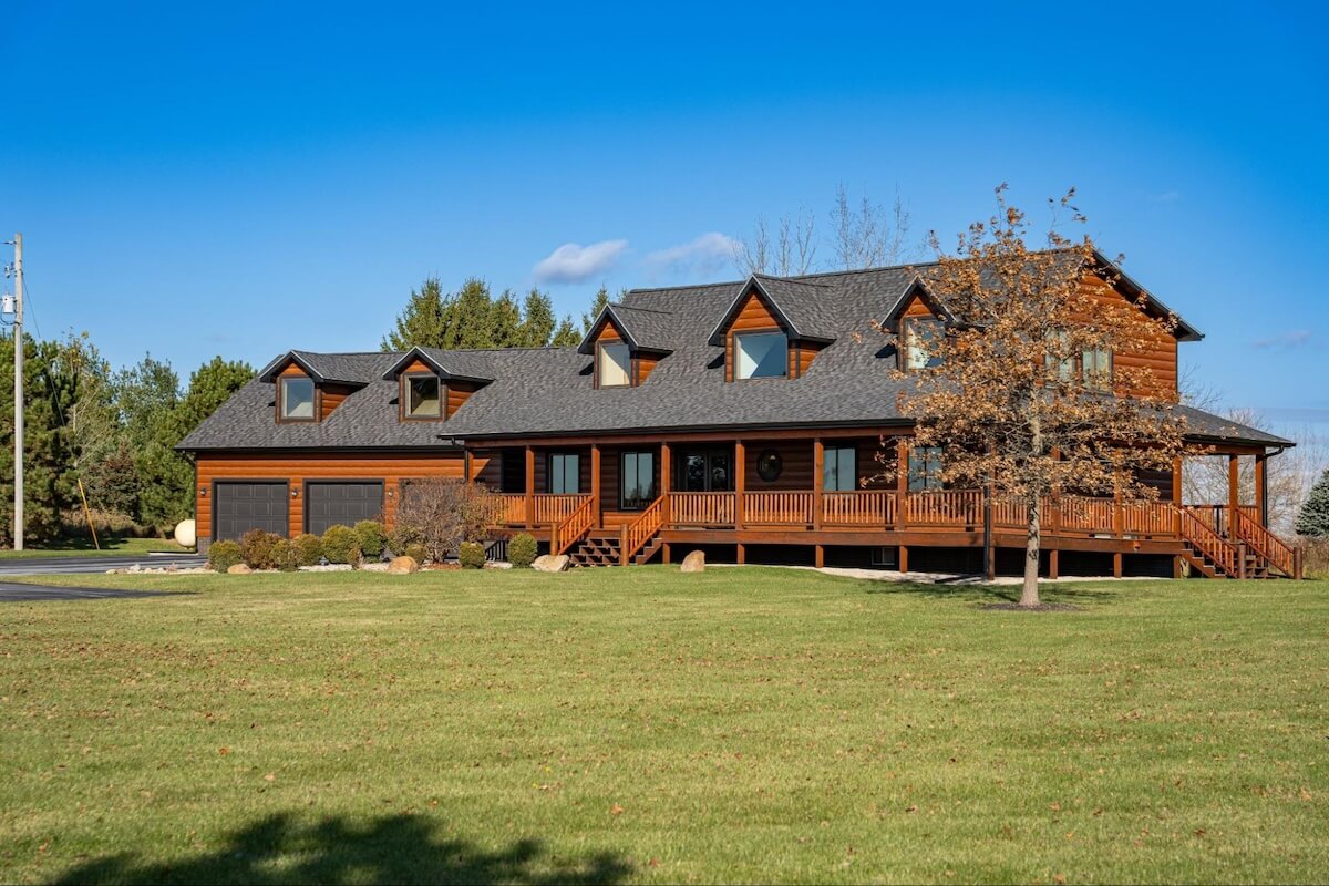 Exterior of a home with wood-look TruLog steel lap siding in a warm brown finish.